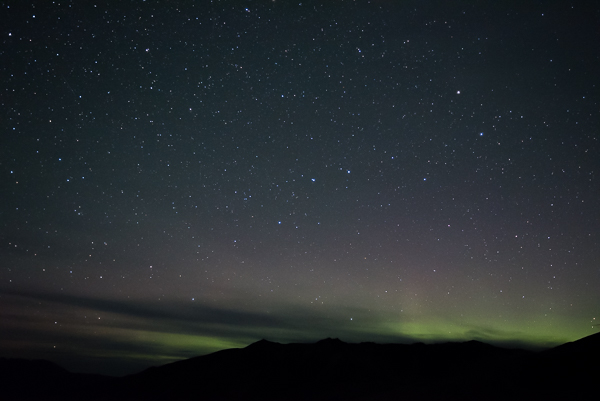 Faint Aurora Light from The Valley of Ten Thousand Smokes Green and pink lights from the Aurora over mountain ridge