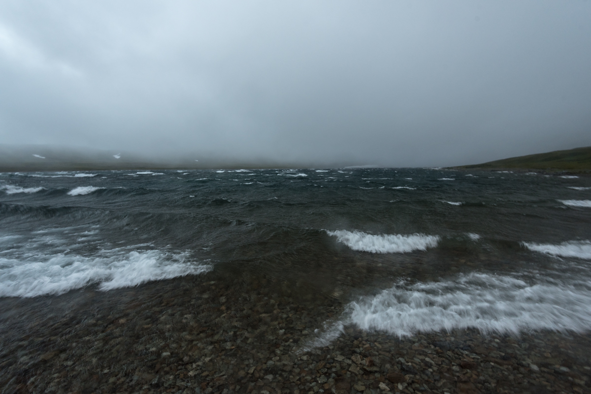 Strong winds whip up the waters of Mirror Lake, Katmai Preserve Churned up water from winds and low clouds