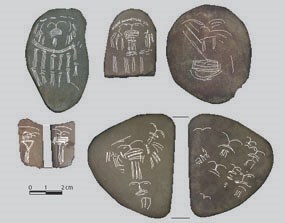 Incised pebbles are thought to be either game pieces or ritual items.