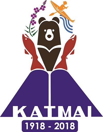 Katmai's centennial logo: purple flowers, red salmon, and a traditional kayaker on a river surround a brown bear on top of a volcano with the text katmai 1918-2018