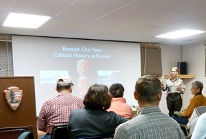 A-ranger-begins-her-evening-program in the Brooks Camp Auditorium