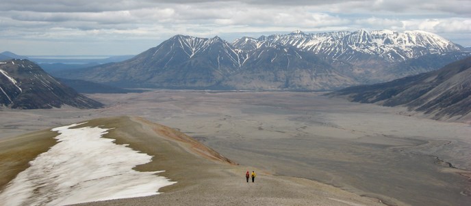 Hikers descend the pumice coverd slopes of Broken Mountain