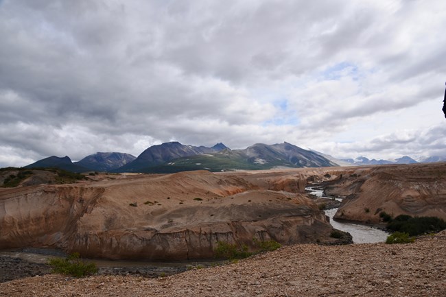 River winding through ashen valley