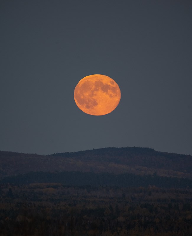 The supermoon is visible over Patten.