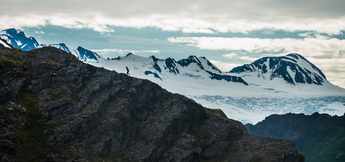 NPS staff hikes up a ridge while routefinding near Bear Glacier. Photo: J.Byers/NPS