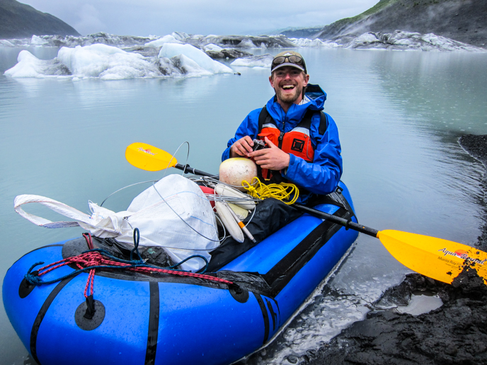 NPS Physical Science Technician prepares to install pressure transducers in the source lake using a packraft. Photo: T. Fulton/NPS