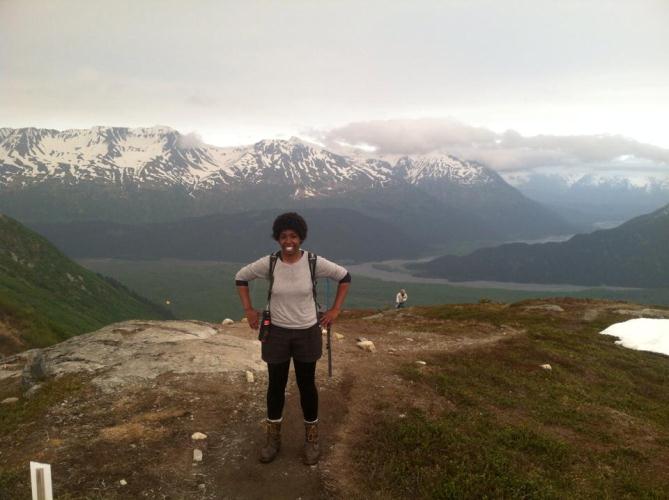Image of SCA intern standing at the end of the Harding Icefield. Image of SCA intern standing at the end of the Harding Icefield.