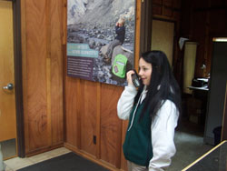Corianne testing a radio at Exit Glacier