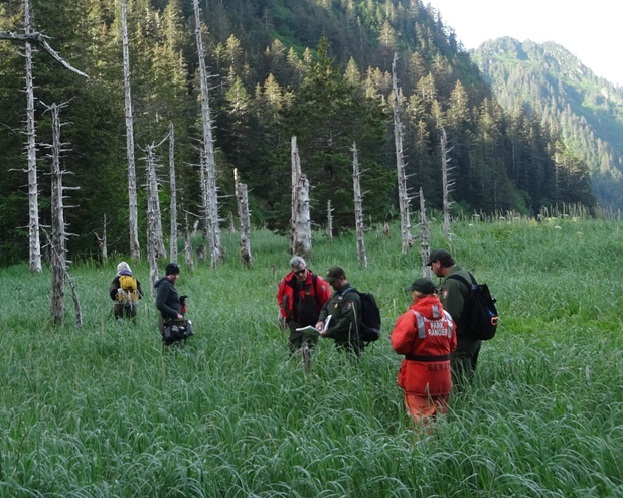 Park staff at a pre-contact site. Park staff at a pre-contact site.