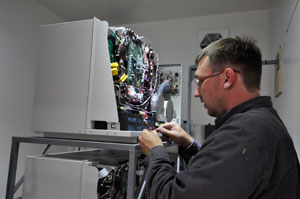 technician installing fuel cell at Exit Glacier Nature Center.