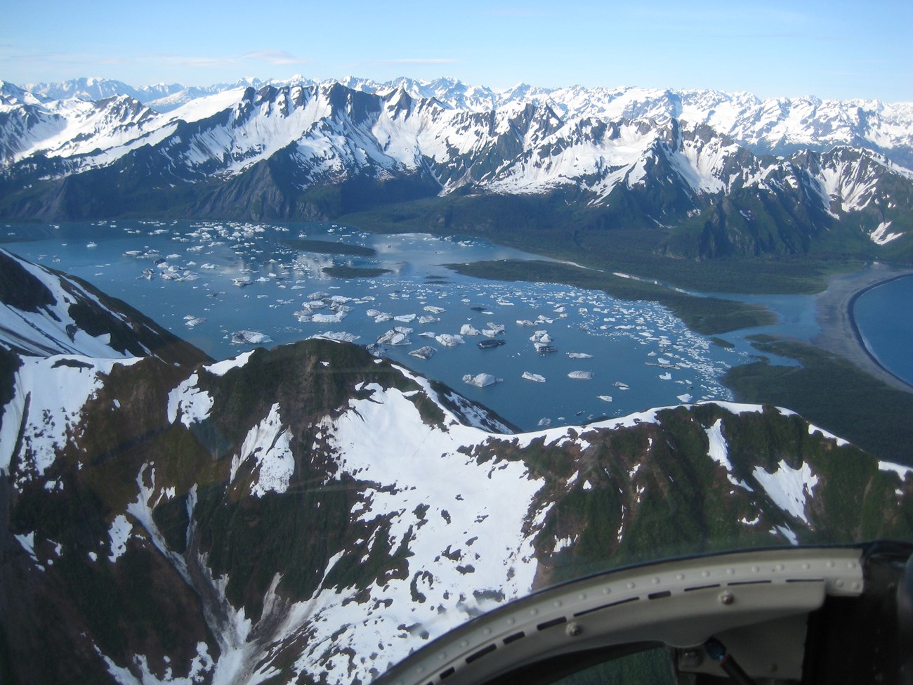 A aerial view of icebergs in a glacial lagoon