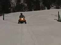Snowmachine on Exit Glacier Road. Snowmachine on Exit Glacier Road.