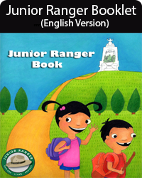 2 Cartoon images of kids wave on a path from a white monument. Text: Junior Ranger Book.