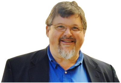 Man wearing glasses smiling.