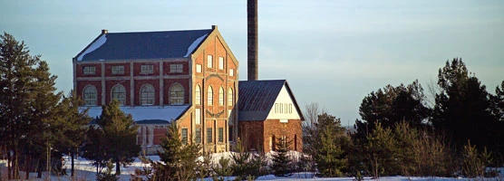 The Nordberg Hoist House at the former Quincy Copper Mining Company catches the last rays of the winter sun. NPS Photo. Dan Johnson