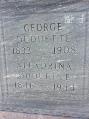 A grave marker that reads: George Duquette, 1833-1908, Alexdrina Duquette, 1846-1944