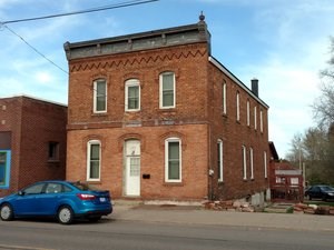 A brick facade two-story building.