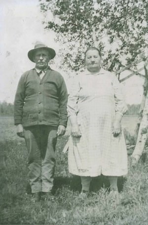 Two people stand and pose for a photograph.