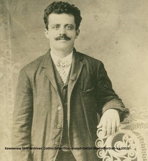 A man poses for a studio portrait.