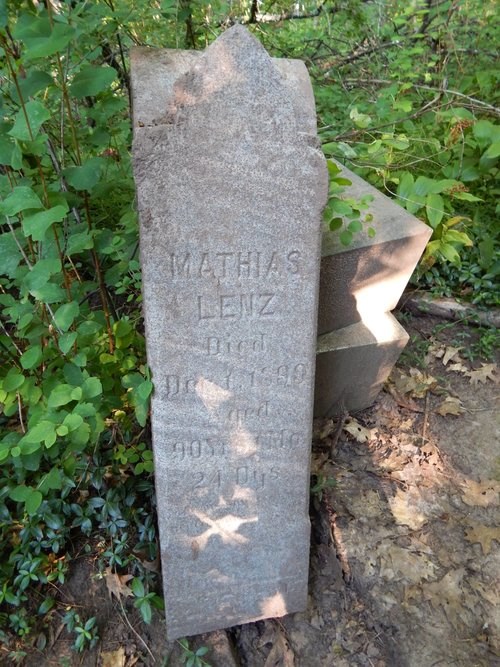 A grave marker reads: Mathias Lenz died December 1, 1899