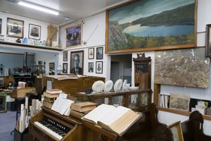 A collection of eclectic items are on display in a room.