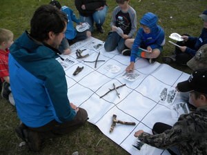 A group of students work a puzzle together.