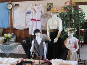 Mannequins with early 20th century clothing on.