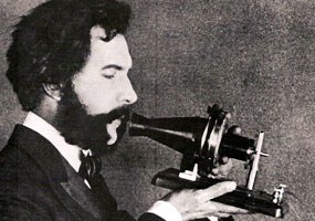 1876 photograph of Alexander Graham Bell speaking into telephone
