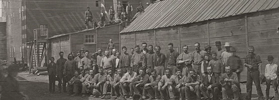 Historic photo: Mine workers pose outside the Hecla Mining Company