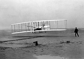 On December 17th at Kitty Hawk, North Carolina, Orville Wright pilots the Flyer for 120 feet into a freezing headwind. The achievement marks the first sustained powered flight in a heavier-than-air machine.