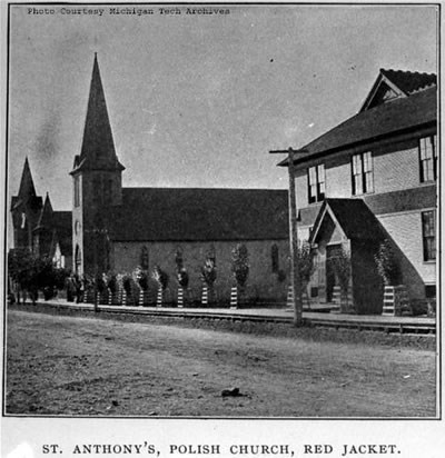 Two churches and a building with a road in front.