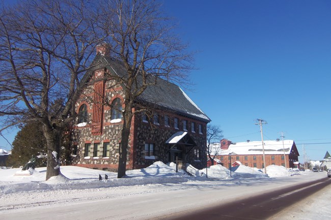 Lake Superior Collection Management Center archives and museum storage facilities, the historic former Calumet and Hecla Mining Company public library and warehouse buildings, are shown here in March of 2015 at Keweenaw National Historical Park in Calumet