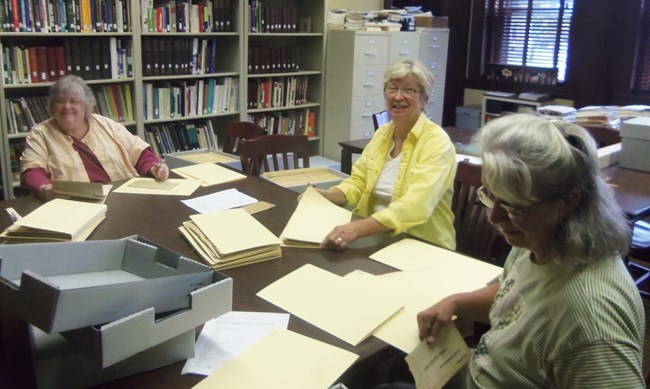 Avis West, Anita Campbell, and Ruth Gleckler, members of the Houghton Keweenaw County Genealogical Society, are seen here in the LSCMC archives reading room.  The society, as well as individual volunteers, logged many hours for the LSCMC in 2017.