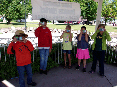 5 youth pose for a photo in a pavilion