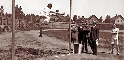 A student does a high jump in Calumet in this circa 1925 photo.