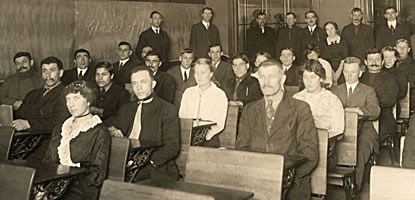 A night class is conducted for immigrants to the Copper Country in the early 1900s.