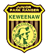 Keweenaw National Historical Park junior ranger badge. A miner wearing a hardhat encircled by National Historical Park with the overhead title Junior Park Ranger Keweenaw
