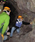 A guide points out some of the remaining copper ore on an Adventure Mine tour. Click here to visit their website.