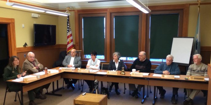 Advisory Commission members sit around a table and discuss topics at a quarterly meeting. Advisory Commission members sit around a table and discuss topics at a quarterly meeting.