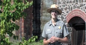 photo: Ranger Kristen Schmitt outside Quincy Mine's #2 Shaft-rockhouse.