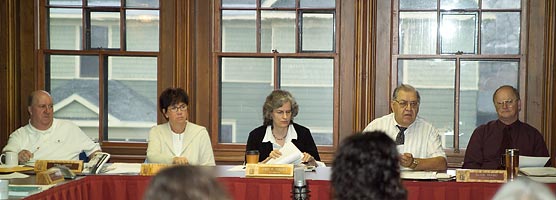 Commission members Paul Lehto, Sue Cone, Kim Hoagland, Rev. Roabert Langseth and Clyde Raasio, listen to a question at a quarterly meeting.