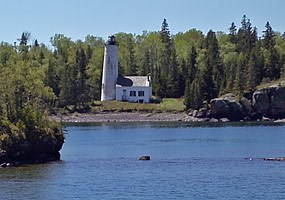 The Rock Harbor Lighthouse greets visitors to Isle Royale National Park arriving on the Ranger III.