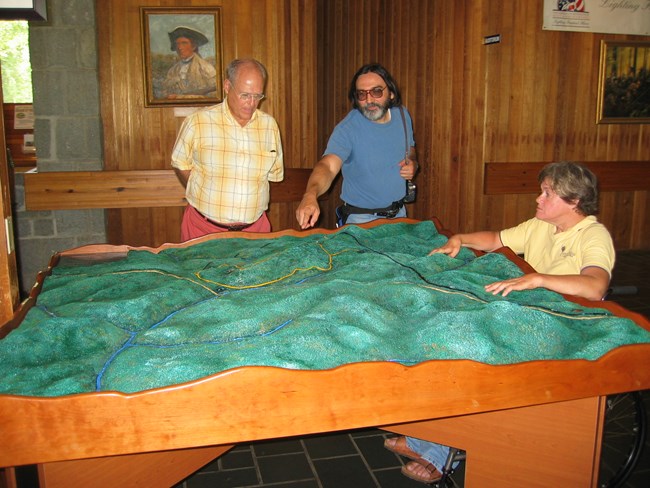A tactile map of the Kings Mountain Battlefield that is waist high in the visitor center.