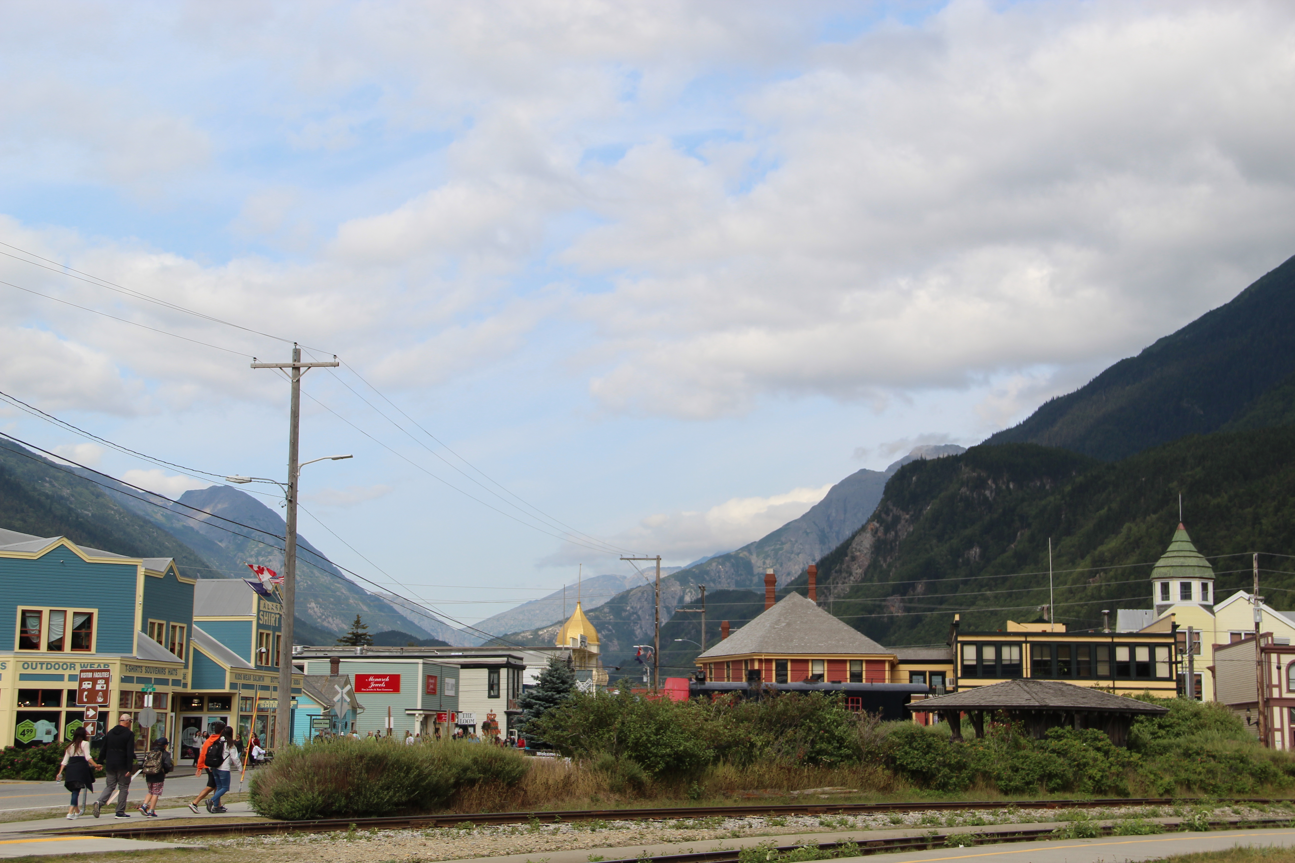 a brightly colored town in a narrow mountain valley
