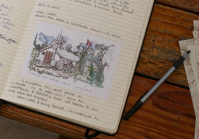 Close up of trail journal with water color illustration Close up of trail journal with water color illustration