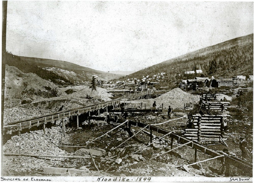 Diverted above ground steams (sluice boxes), mine tailings, and boardwalks on Eldorado in 1899.