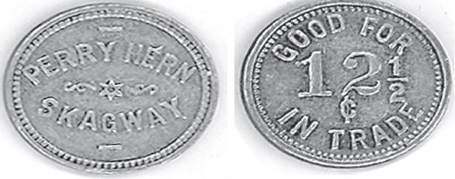 Left: oval coin reading "Perry Hern Skagway"
Right: reverse of oval coin reading "Good for 12 1/2 cents in trade"