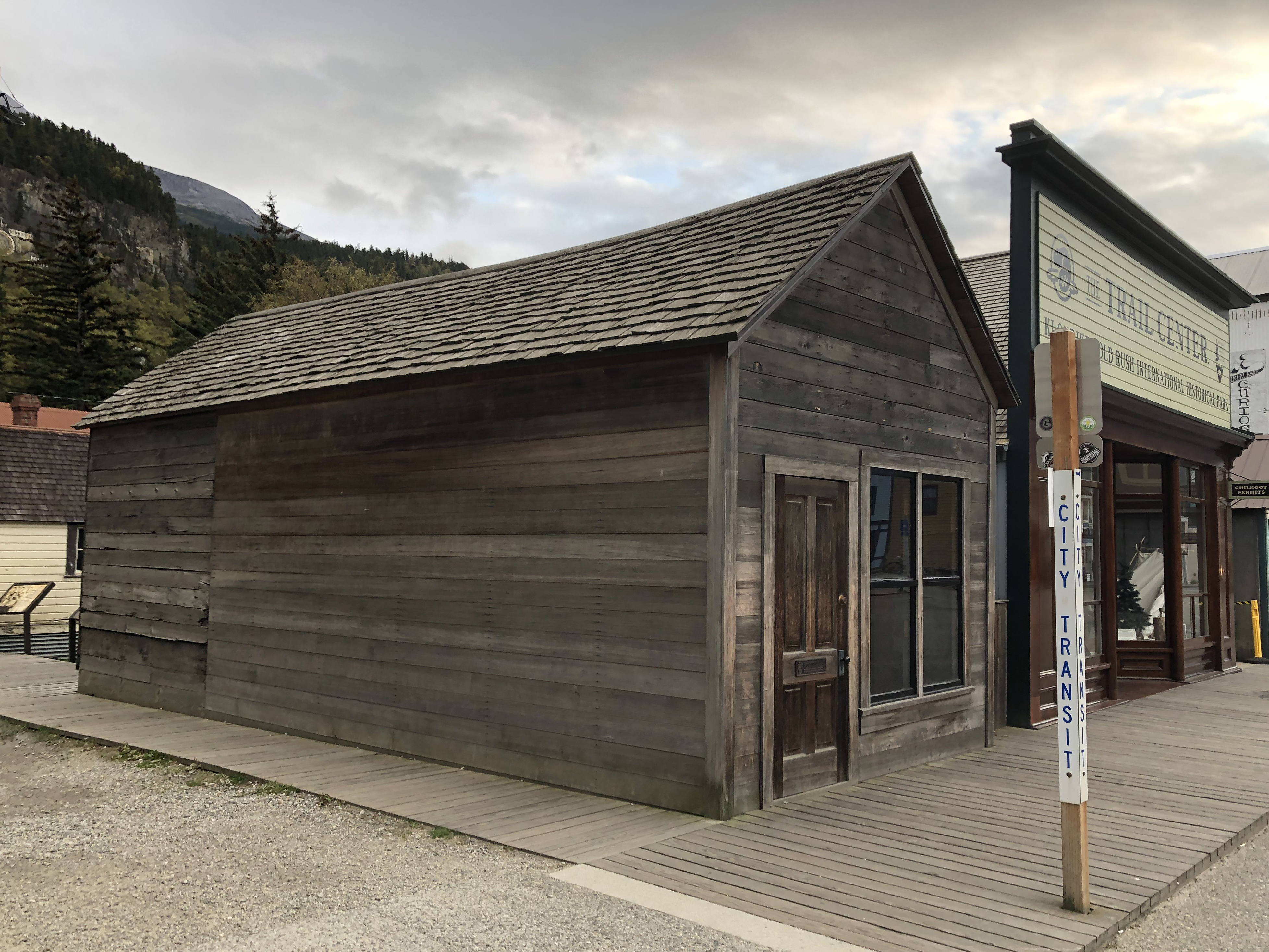 a small one story building bordered by boardwalk on two sides
