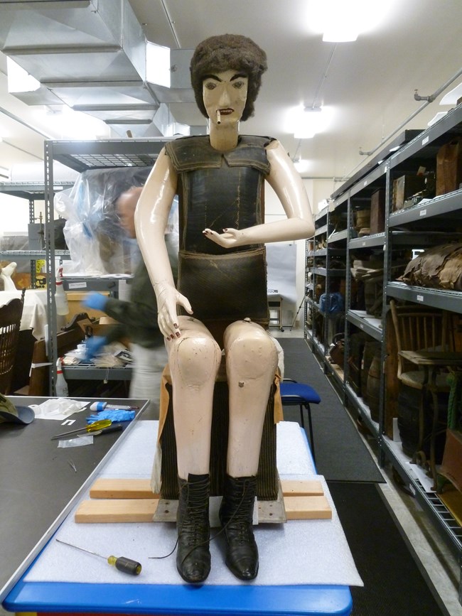 Lady Lou, a manikin, without her dress to show the rubber tires that make up her torso from restoration in 2012.