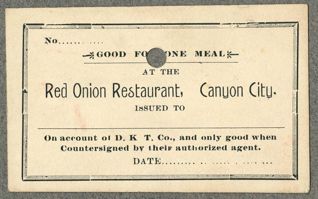 Business card reading "Good for one meal at the Red Onion Restaurant, Canyon City"